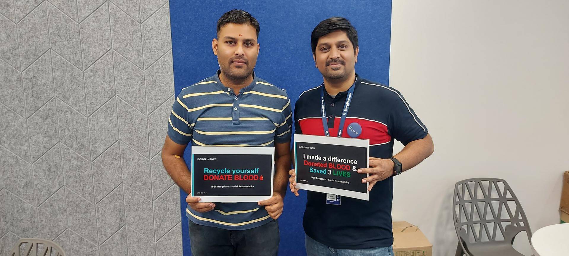 Two men holding signs