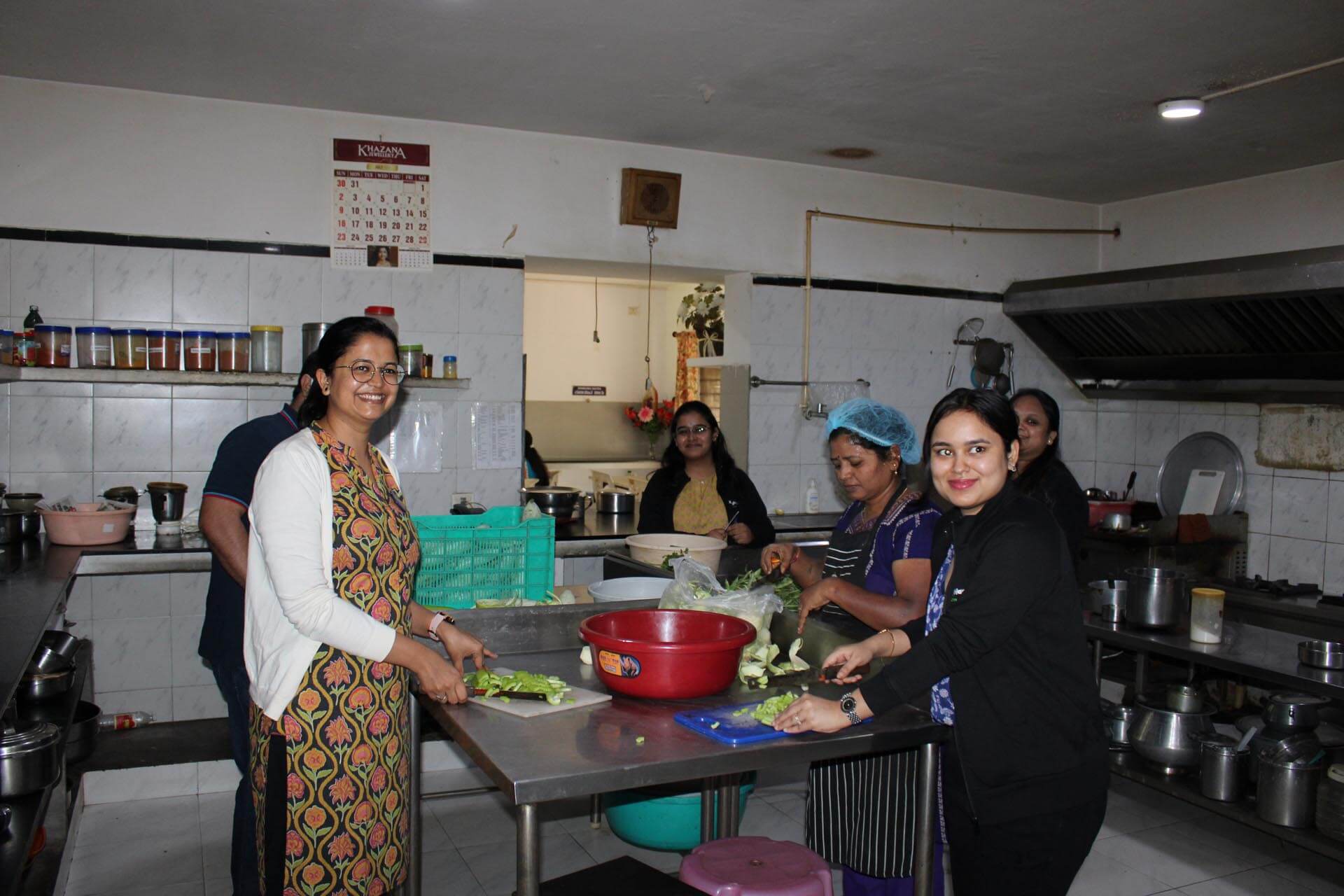 a group of women in a kitchen