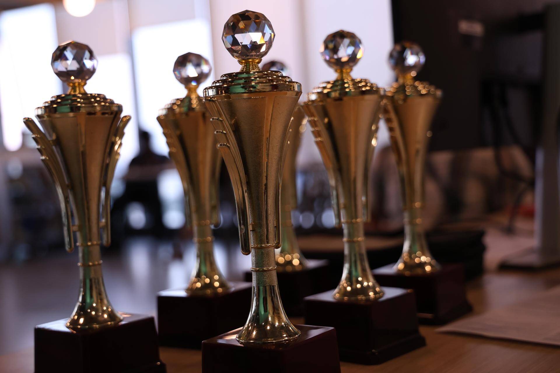 a group of trophies on a table