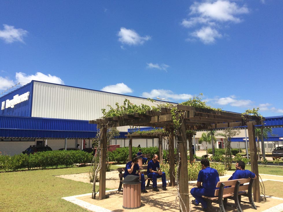 Employees sitting outside on benches