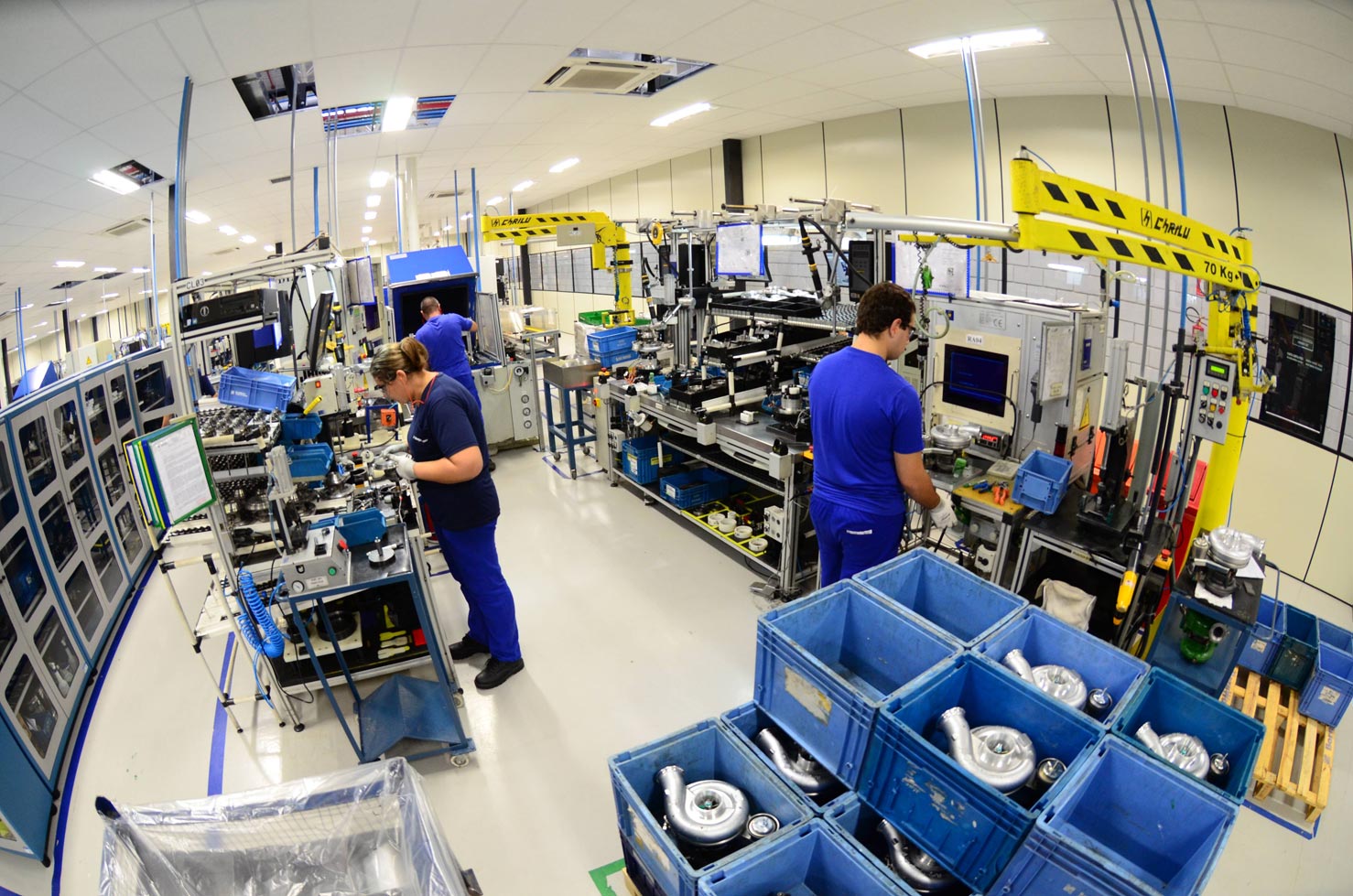 Turbochargers and employees in a lab
