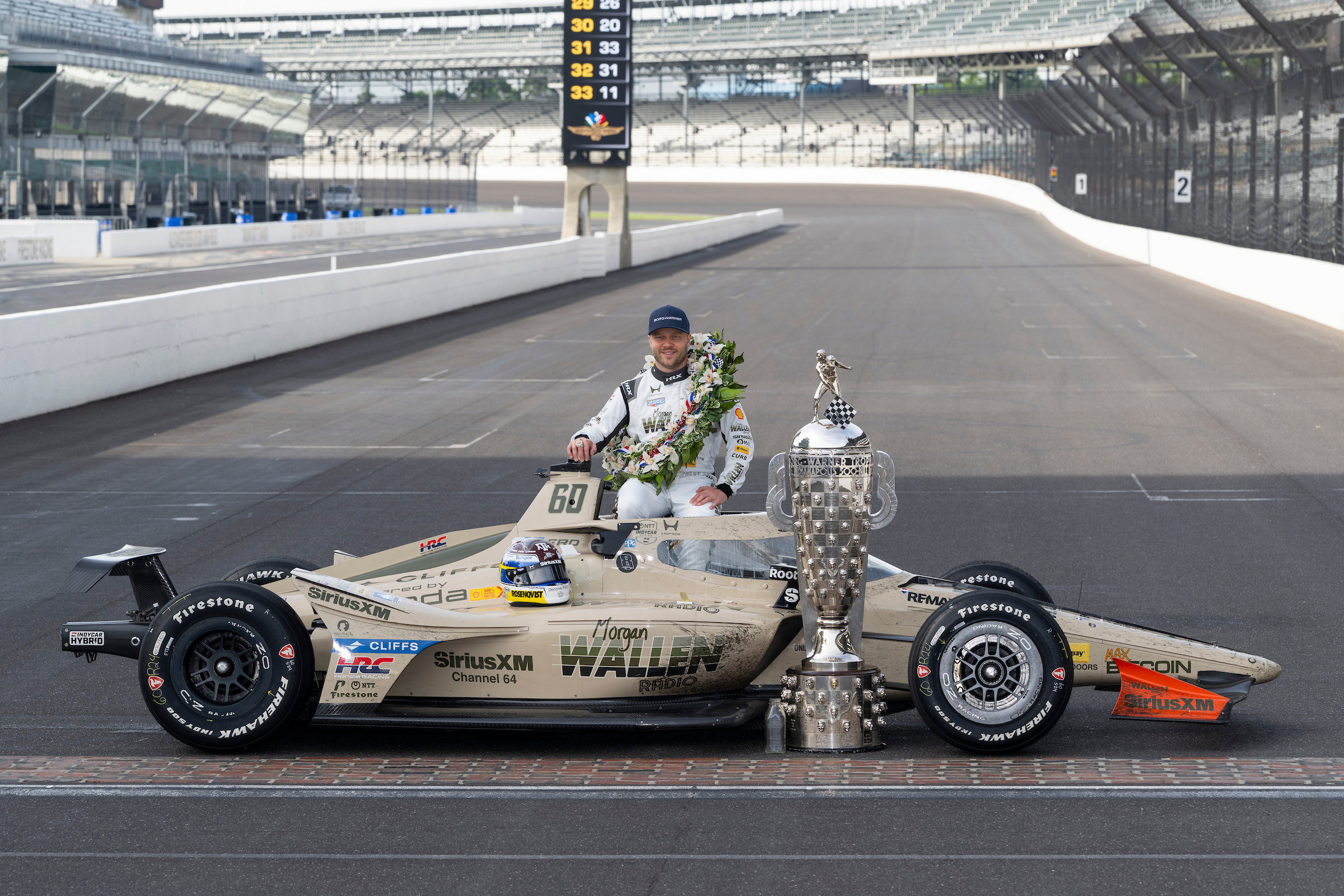 Felix Rosenqvist with Borg-Warner Trophy and Wreath on the yard of bricks