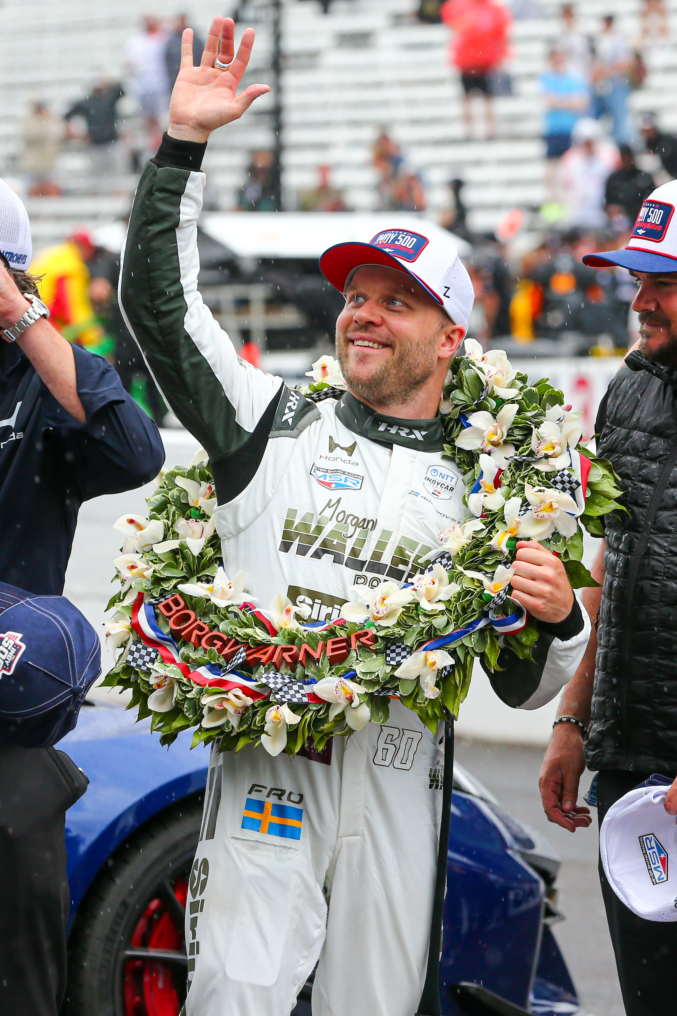 Felix Rosenqvist waves at fans with BorgWarner Wreath