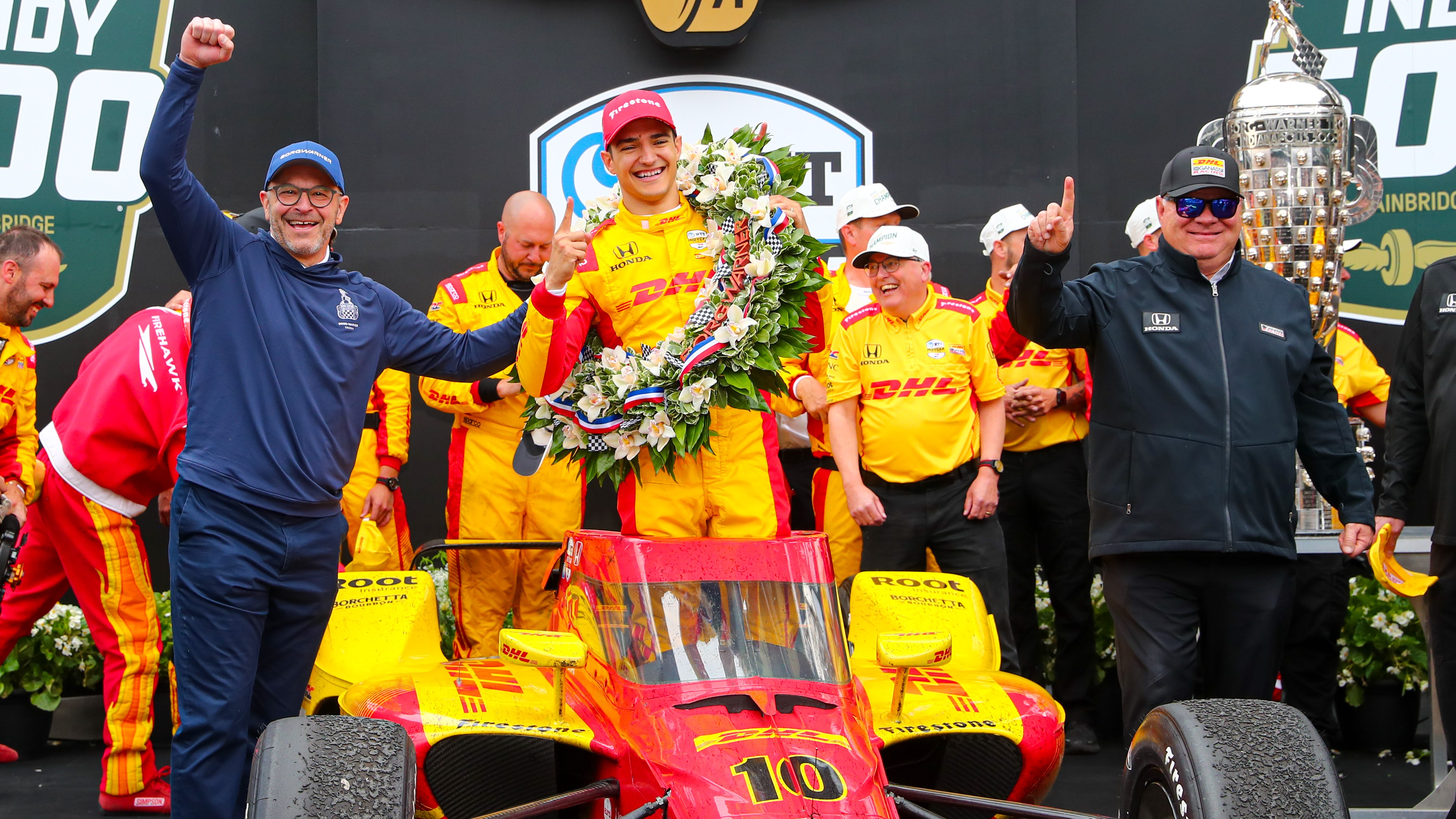 Group of people celebrate motorsport win