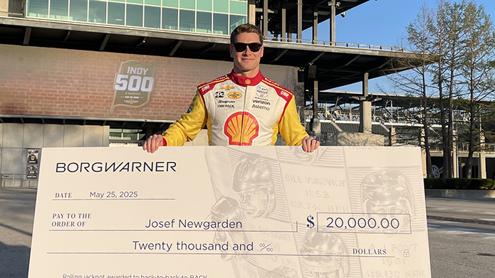 IndyCar Driver Joseph Newgarden with large check