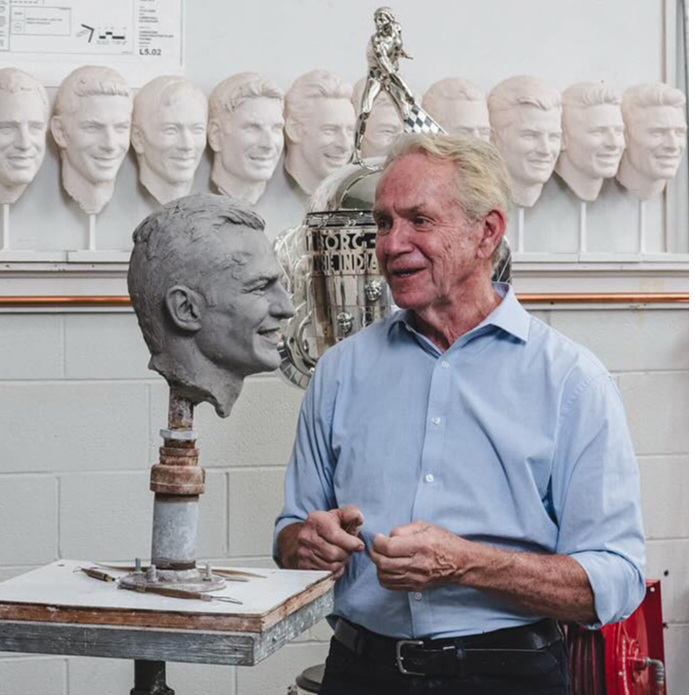Sculptor William Behrends with life size trophy clay face