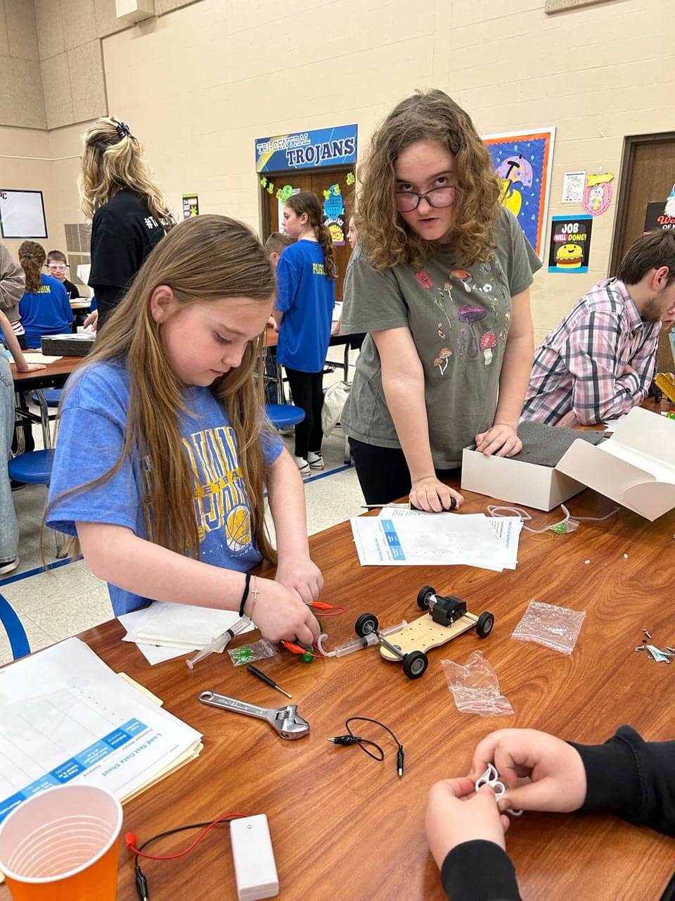 a group of girls working on a project