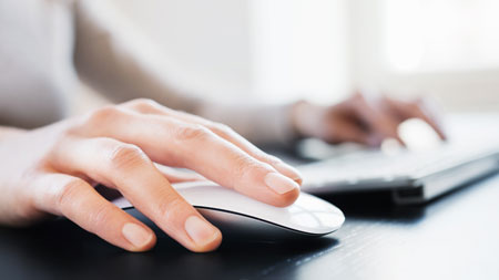 Person using a keyboard and mouse