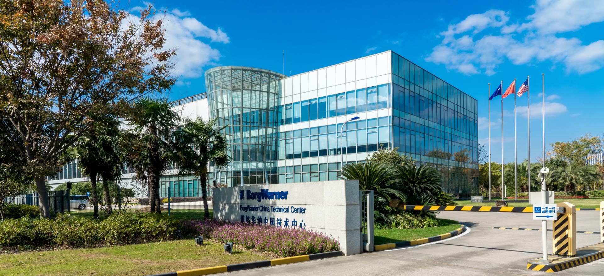 Front entrance to building with trees and grass